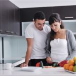 husband wife cooking together
