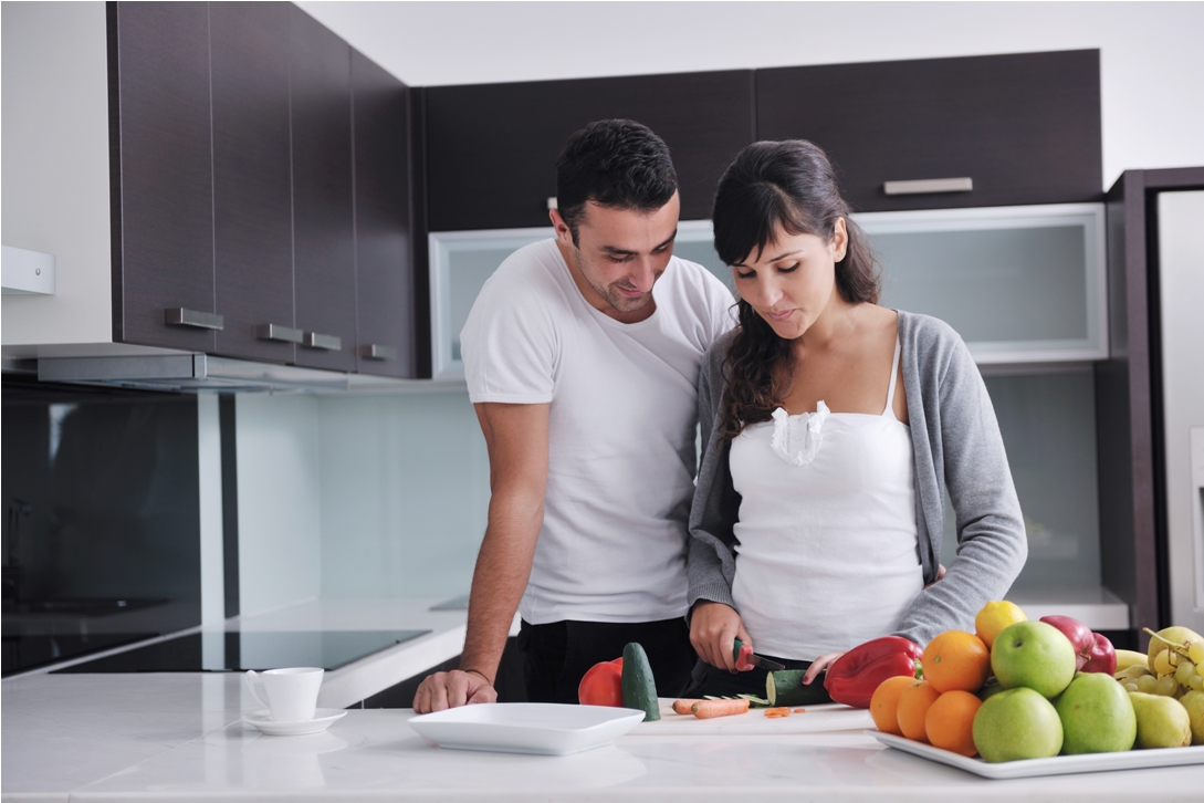 husband wife cooking together